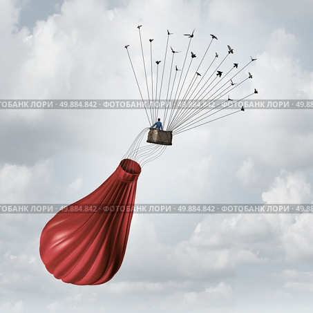 Business team solution concept and teamwork recovery symbol as a businessman in a deflated broken red hot air balloon being saved and rescued by a group of flying birds pulling the object upward with wires. Стоковое фото, агентство Ingram Publishing / Фотобанк Лори