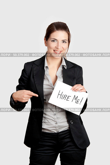 Business woman holding a card board with the text message "Hire me" Стоковое фото, агентство Ingram Publishing / Фотобанк Лори