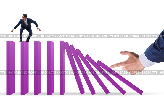 Businessman in domino effect concept. Стоковое фото, фотограф Elnur / Фотобанк Лори