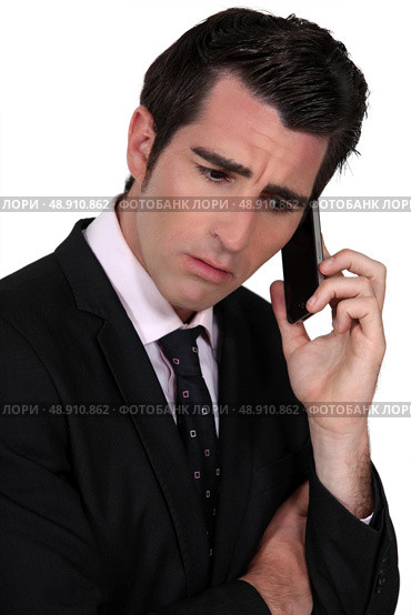 businessman on the phone looking concerned. Стоковое фото, агентство Ingram Publishing / Фотобанк Лори