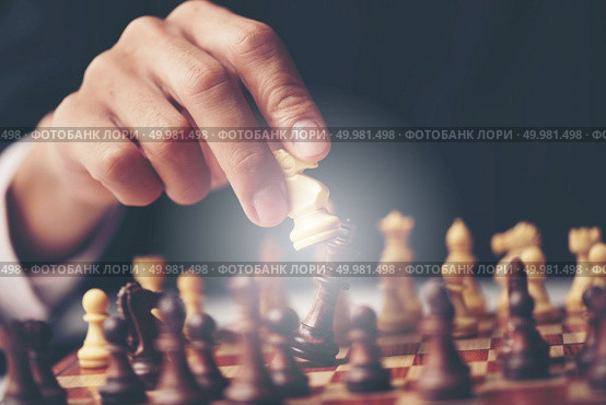 Businessman play with chess game. concept of business strategy and tactic. Стоковое фото, агентство Ingram Publishing / Фотобанк Лори
