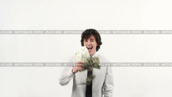 Businessman throws up a pack of dollars on white background. Стоковое видео, видеограф Андрей Зык / Фотобанк Лори