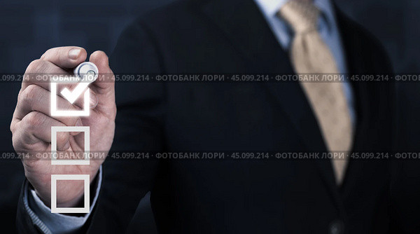 Businessman use pen to tick correct sign mark in checkbox for quality document control checklist and business approve project concept. Electronic smart checklist and document management. Стоковое фото, фотограф Павел Муравьев / Фотобанк Лори