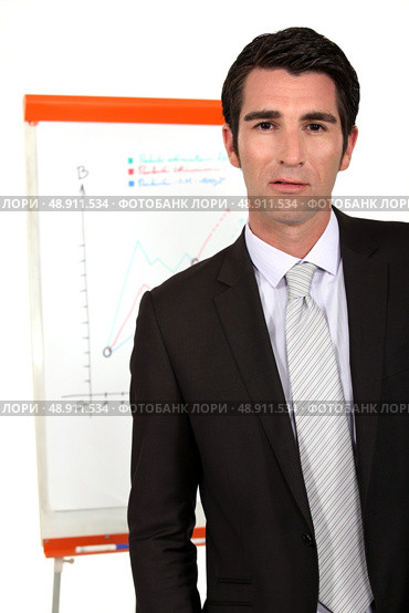 Businessman with a flipchart. Стоковое фото, агентство Ingram Publishing / Фотобанк Лори