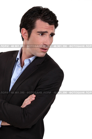 Businessman with his arms folded in disbelief. Стоковое фото, агентство Ingram Publishing / Фотобанк Лори