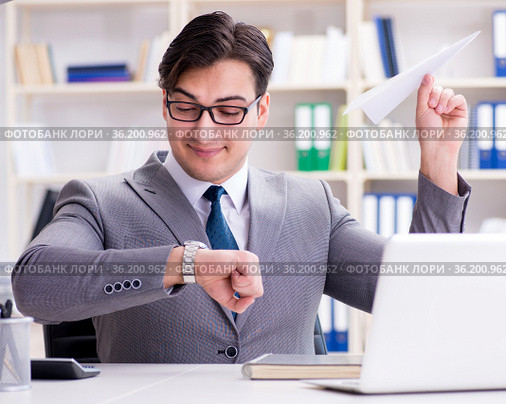 Businessman with paper airplane in office. Стоковое фото, фотограф Elnur / Фотобанк Лори