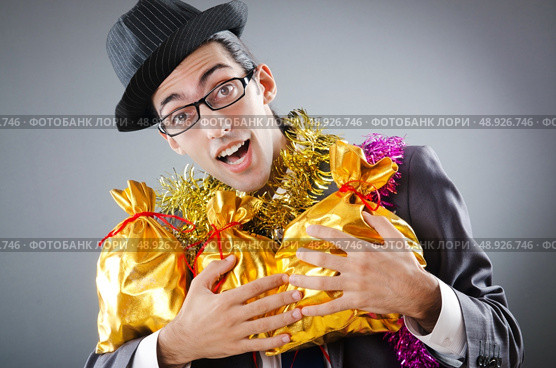 Businessman with sacks of presents. Стоковое фото, агентство Ingram Publishing / Фотобанк Лори