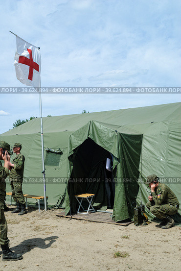 Cadet with radio station at medical tent (2016 год). Редакционное фото, фотограф Сергей Буторин / Фотобанк Лори