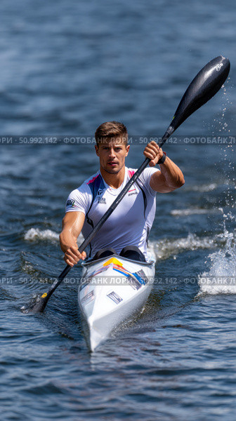 Canoe sprint kayaker paddling during competition on lake. Стоковое фото, фотограф Юрий Поздников / Фотобанк Лори