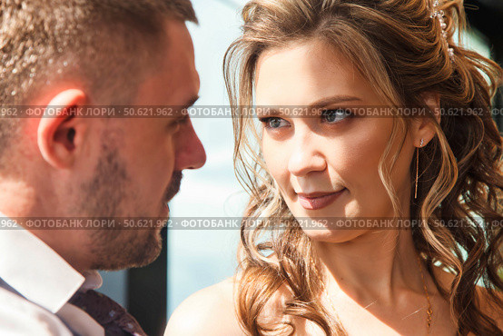 Captivating Gaze Exchanged Between Two Lovers in a Bright, Modern Setting. Стоковое фото, фотограф Aleksandr Golubev / Фотобанк Лори