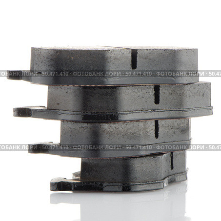 Car brake pads on white reflective background. Стоковое фото, агентство Ingram Publishing / Фотобанк Лори