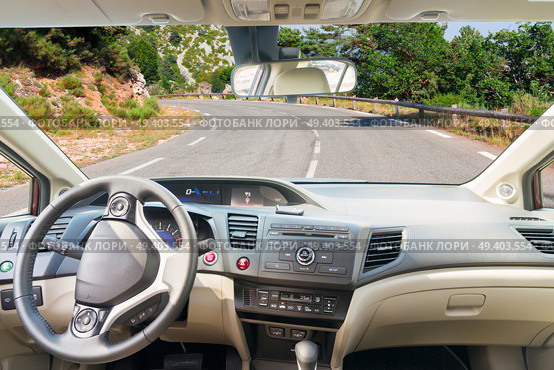 car windscreen with country road, view inside out. car windscreen with road. Стоковое фото, агентство Ingram Publishing / Фотобанк Лори