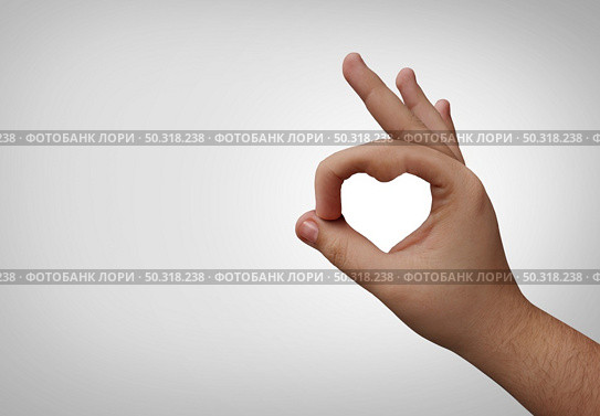 Caring touch concept and human care for good causes as a generosity symbol representing health services love or donating  for the welfare of the poor or needy and philanthropy. Стоковое фото, агентство Ingram Publishing / Фотобанк Лори