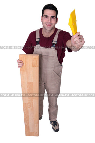 Carpenter posing with floorboards. Стоковое фото, агентство Ingram Publishing / Фотобанк Лори