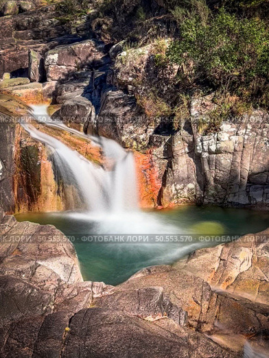 Cascata do Tahiti is also known as Fecha das Barjas and is a waterfall with several natural pools where you can swim. It is located in the Peneda Geres National Park in the north of Portugal. Стоковое фото, агентство Ingram Publishing / Фотобанк Лори
