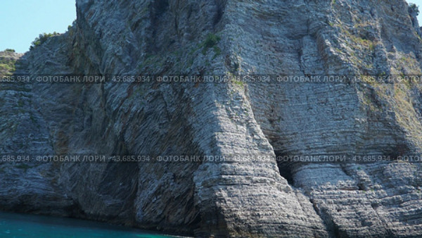 Cave Pecin bay between Petrovac - Sutomore. Queen Beach. Hills, inaccessible rocks. Kraljicina plaza. Canj Montenegro. Flysch, marine sedimentary rocks, lithological layers. Adriatic Mediterranean sea (2024 год). Стоковое видео, видеограф Юлия Петровская / Фотобанк Лори