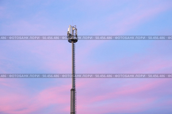 Cell phone tower during the sunset. Telecomunication scene. Стоковое фото, агентство Ingram Publishing / Фотобанк Лори