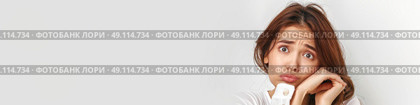 Charming woman is playfully contorting her face with her hands, creating a comical expression. Стоковое AI-изображение, AI-художник Данила Большаков / Фотобанк Лори