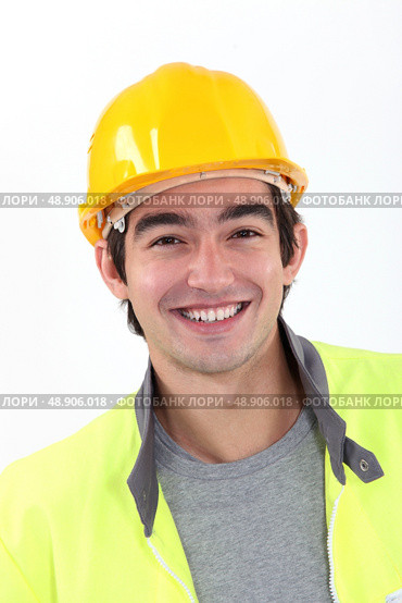 Cheerful young construction worker. Стоковое фото, агентство Ingram Publishing / Фотобанк Лори