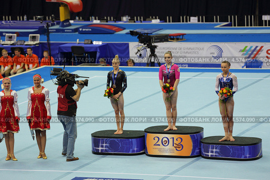 Чемпионат Европы по спортивной гимнастике 2013 года. Москва, СК "Олимпийский". Победители состязаний в на разновысоких брусьях - Алия Мустафина, Йонна Адлертег и Мария Пасека. Редакционное фото, фотограф Игорь Долгов / Фотобанк Лори
