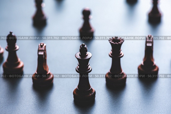 Chess pieces board game in business success leadership concept. Стоковое фото, агентство Ingram Publishing / Фотобанк Лори