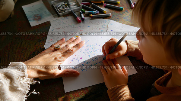 Child engages in creative writing while adult provides guidance at home during afternoon hours. Стоковое AI-изображение, AI-художник Сергей Толмачёв / Фотобанк Лори