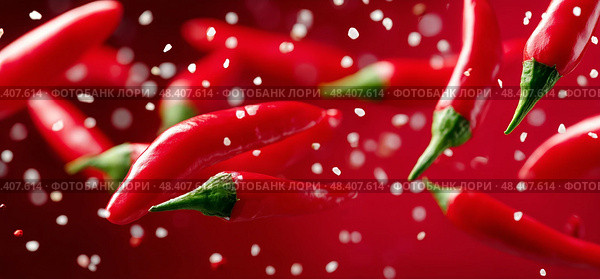 Chilis Fall Against a Vibrant Red Background Creating a Striking Visual Contrast. Стоковое AI-изображение, AI-художник Юлия Гапеенко / Фотобанк Лори