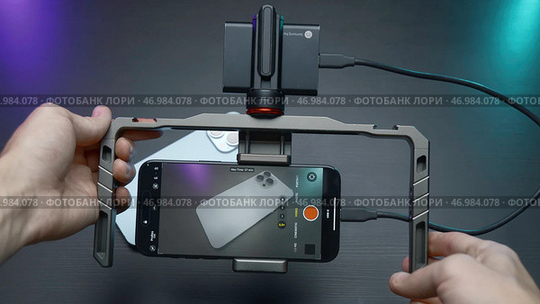 China, Beijing - September 15, 2023: Holder for shooting with stabilization for phone. Редакционное фото, фотограф David Kashakhi / Фотобанк Лори