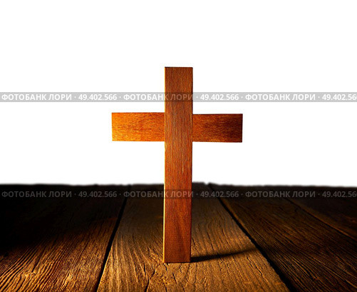 Christian wood cross on white and wooden background. Стоковое фото, агентство Ingram Publishing / Фотобанк Лори