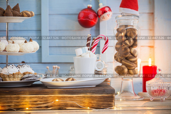 Christmas bar cacao decoration with cookies and sweets on blue wooden background in vintage style. Стоковое фото, фотограф Майя Крученкова / Фотобанк Лори