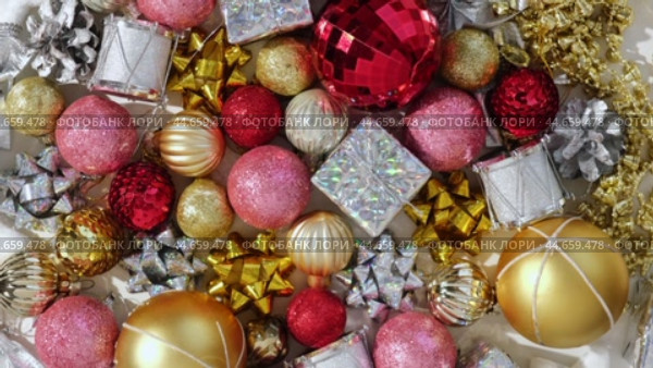 Christmas Ornaments Background Rotation, Spinning. Close up a Glitter Christmas Tree Decoration Items is Turning. Backdrop of New Year Ornate. Many Shiny Xmas Bauble, Balls and Bulbs. Top View, Frame. Стоковое видео, видеограф Марина Демидюк / Фотобанк Лори