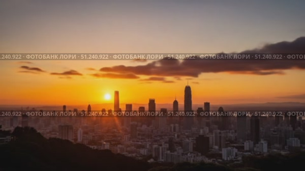 City skyline at sunset with silhouettes of skyscrapers and clouds. Стоковое AI-видео, аниматор KATERINA AI / Фотобанк Лори