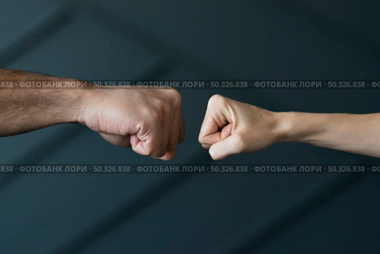 close up friends ready touch fists. Beautiful photo. close up friends ready touch fists. Стоковое фото, агентство Ingram Publishing / Фотобанк Лори