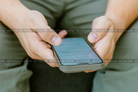Close-up of a man's hand using AI. Стоковое фото, фотограф Feruza Tashmetova / Фотобанк Лори