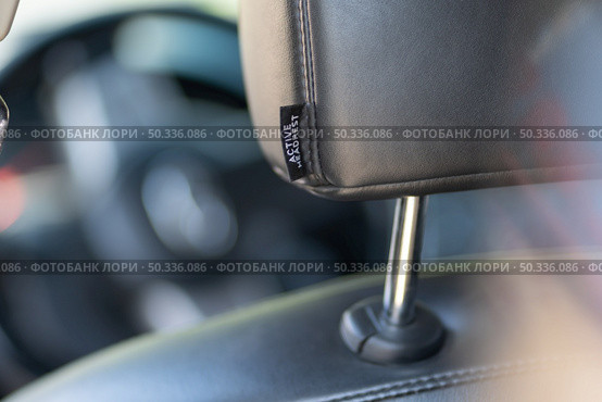 Close-up of leather car headrest. Element of design. Стоковое фото, агентство Ingram Publishing / Фотобанк Лори