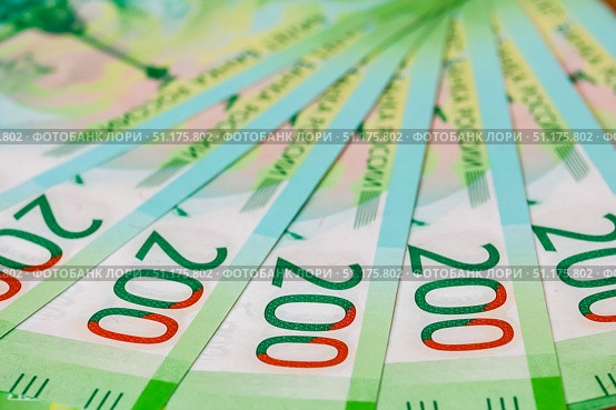Close up of new Russian currency. Banknotes nominal 200 rubles. Russian paper cash money backgroung. Стоковое фото, фотограф Denis Vostrikov / Фотобанк Лори