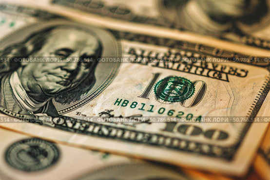 Close up of one hundred dollar bills showing benjamin franklin portrait. Стоковое AI-изображение, AI-художник Иван Рябоконь / Фотобанк Лори