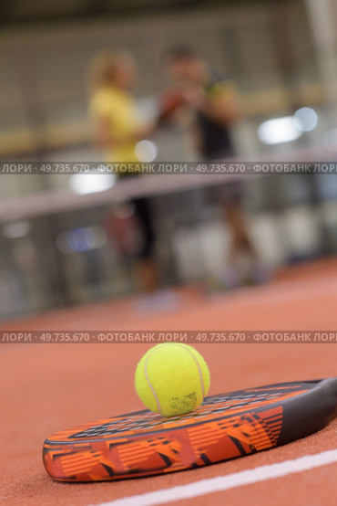 close up of padel racket and ball. Стоковое фото, агентство Ingram Publishing / Фотобанк Лори