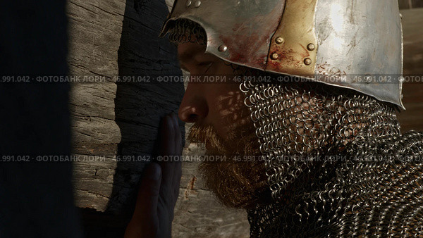 Close up side view of a man in very heavy headdress, middle ages armor concept. Стоковое фото, фотограф David Kashakhi / Фотобанк Лори