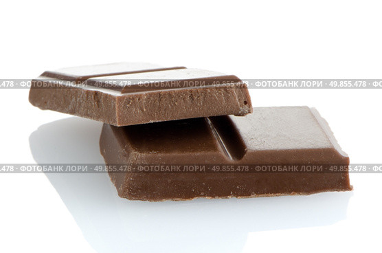 Closeup detail of chocolate parts on white background. Стоковое фото, агентство Ingram Publishing / Фотобанк Лори
