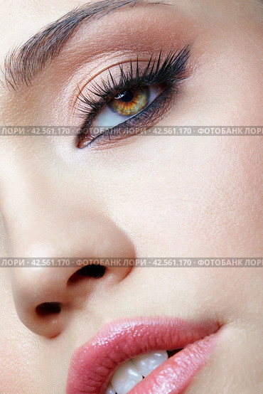 Closeup macro shot of human female face. Woman with eyes and lips beauty makeup. Стоковое фото, фотограф Сергей Пристяжнюк (Serg Zastavkin) / Фотобанк Лори