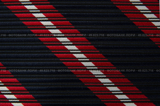 Closeup view of a striped neck tie, could be used as a background. Стоковое фото, агентство Ingram Publishing / Фотобанк Лори