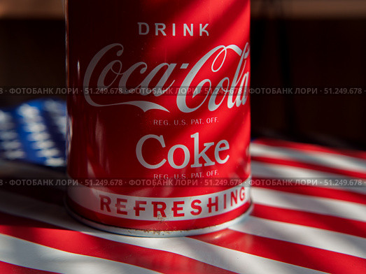 Coca-Cola Classic Drink Can on American Flag Background. Стоковое фото, фотограф Sergakoff / Фотобанк Лори