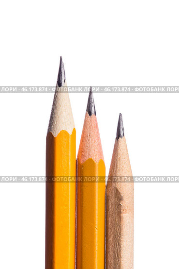 Collection of colored pencils with sharpened tips arranged vertically on a white background for artistic creativity. Стоковое фото, фотограф Сергей Толмачёв / Фотобанк Лори