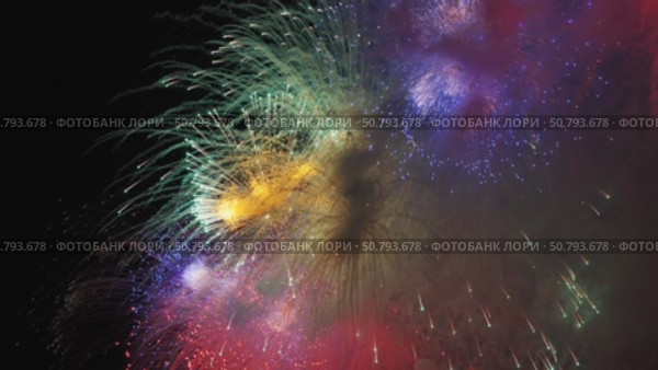 Colorful fireworks exploding in the night sky during a celebration. Стоковое видео, видеограф Mikhail Davidovich / Фотобанк Лори