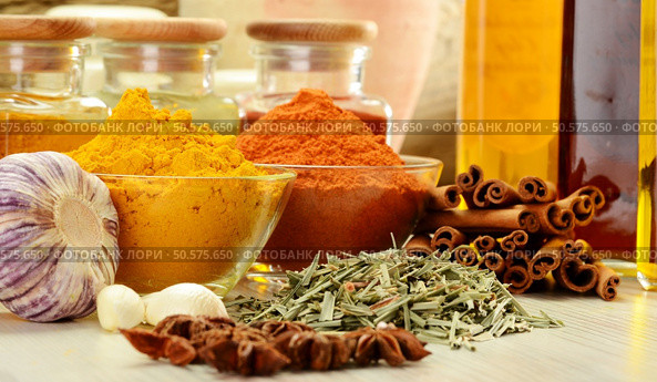 Composition with variety of spices on kitchen table. Стоковое фото, агентство Ingram Publishing / Фотобанк Лори
