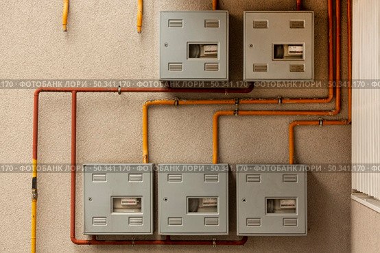 concrete wall with meters pipes. Стоковое фото, агентство Ingram Publishing / Фотобанк Лори