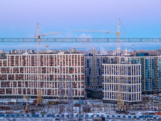 Construction site in the city and cranes. Стоковое фото, фотограф Argument / Фотобанк Лори