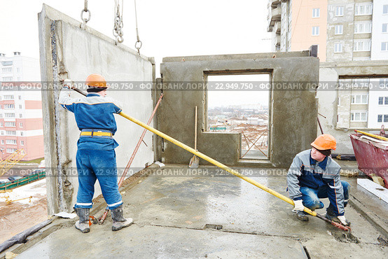 Construction worker. Builders concreter joiners at work. Стоковое фото, фотограф Дмитрий Калиновский / Фотобанк Лори