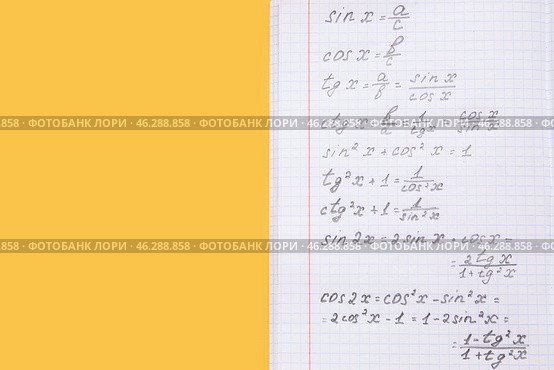 Copybook with maths formulas on yellow background. Стоковое фото, фотограф Pixel_shot / Фотобанк Лори